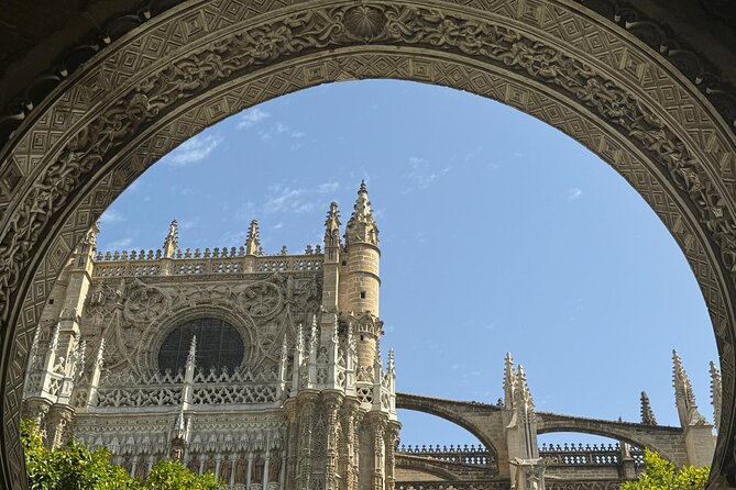 Cathedral Tour of Seville Giralda and Barrio Santa Cruz All in One - Giralda Tower: From Minaret Roots to Christian Bell Tower Views
