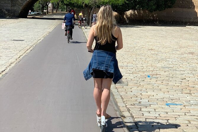 Electric Scooter Rental Seville - Heading back through Royal Tobacco Factory, Alcázar, and a final Cathedral loop