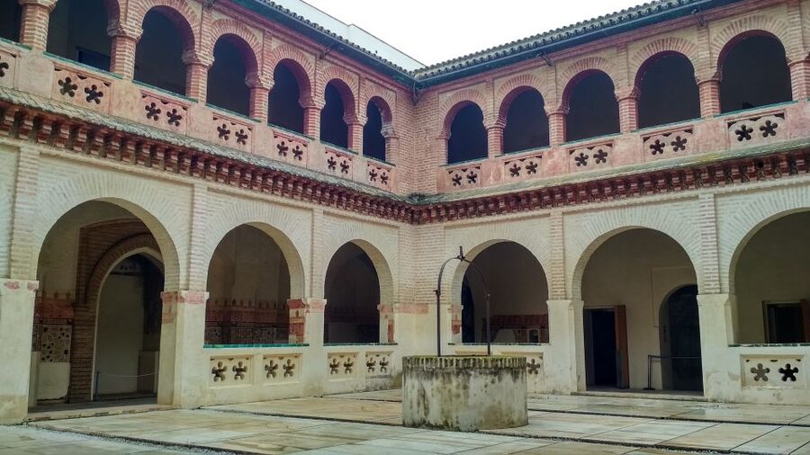 From Seville: Italica Roman City & Medieval Monastery Tour - Italica in 105 Minutes: Amphitheater Energy and Mosaic Details
