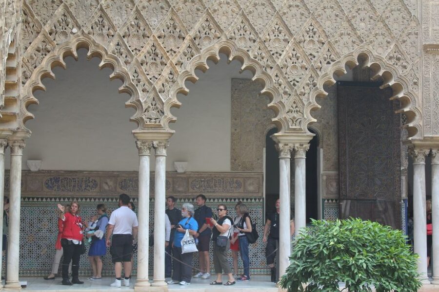 Highlights of Seville Monuments private Guided Tour - Entering the Alcázar: royal palace views and decorative tiles
