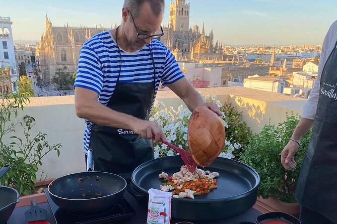 Sevilla: Rooftop Paella Cooking Class & 30-minute expert Q&A - The paella feast: your work lands as dinner