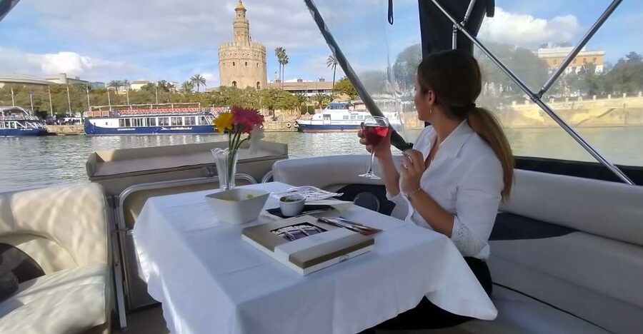 Seville: Exclusive River Boat Tour with Tapas - The route: from La Cartuja to Triana Bridge and back
