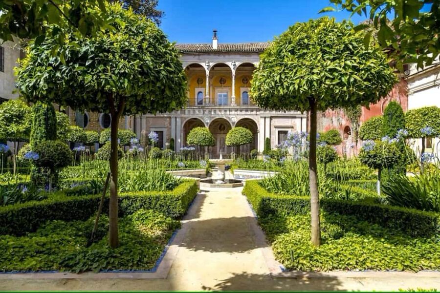 Seville: Guided Tour of Noble Houses and Grand Gardens - Casa Pilatos: blue-and-white tiles, emperor statues, and film-still beauty