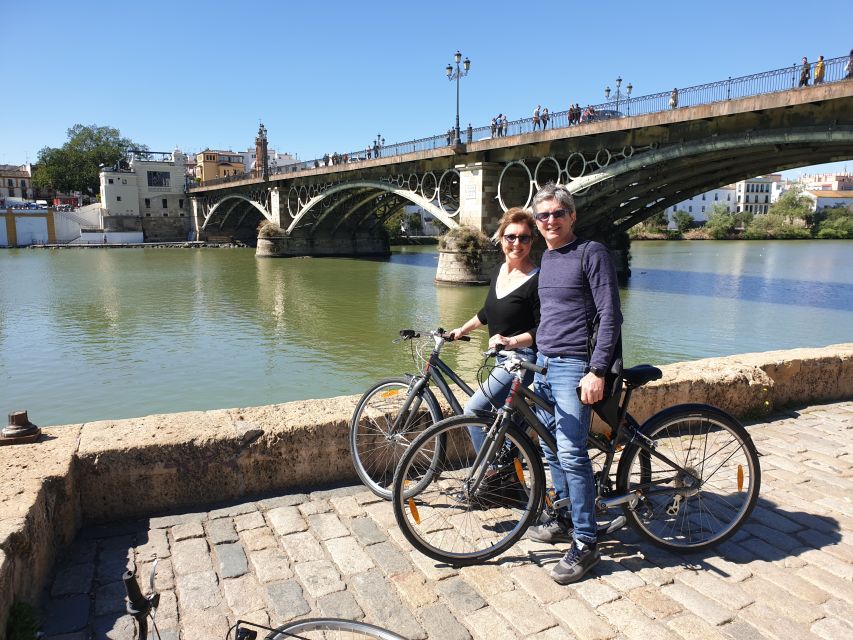 Seville: Highlights Bike Tour with Local Guide - Bullring stop and the value of seeing different sides of Seville