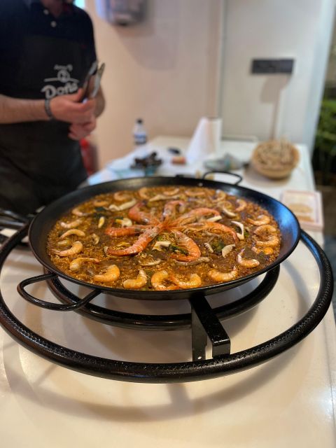 Seville: Paella Dining Experience - Seville at night from a rooftop: the view factor you’ll actually feel