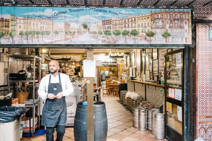Seville: Private Tapas & History Tour in Triana Neighborhood - Stop 1: Los Especiales area walk-in and warm-up