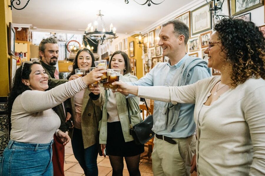 Seville: Private Tapas & History Tour in Triana Neighborhood - Stop 5: Bar Bistec for garlic shrimp, beer/wine, and a longer finale