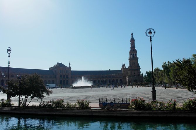 Seville tour with private car - Torre del Oro (36 meters) and the Guadalquivir River stories