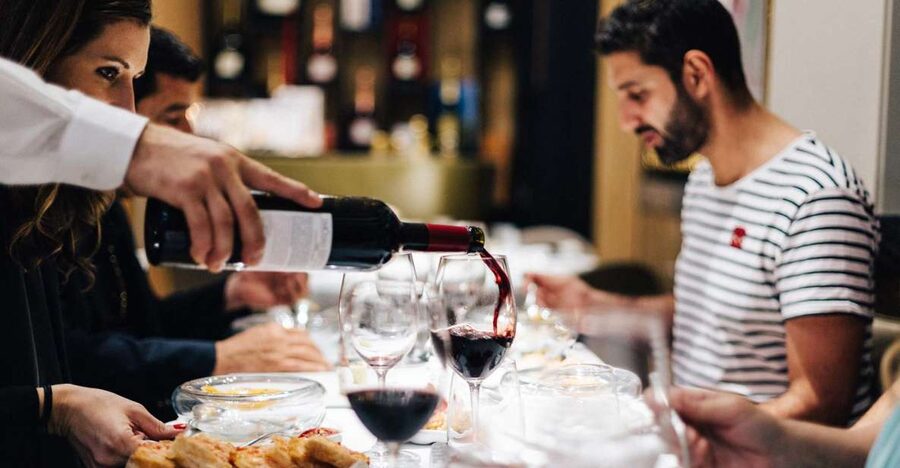Seville: Wine and Gourmet Tapas Tour - First stop: a local bodega where Seville classics get explained