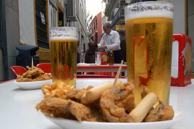 Sevillian tapas tasting on a bicycle (3 bars-3 tapas-3 drinks) - Key highlights to expect