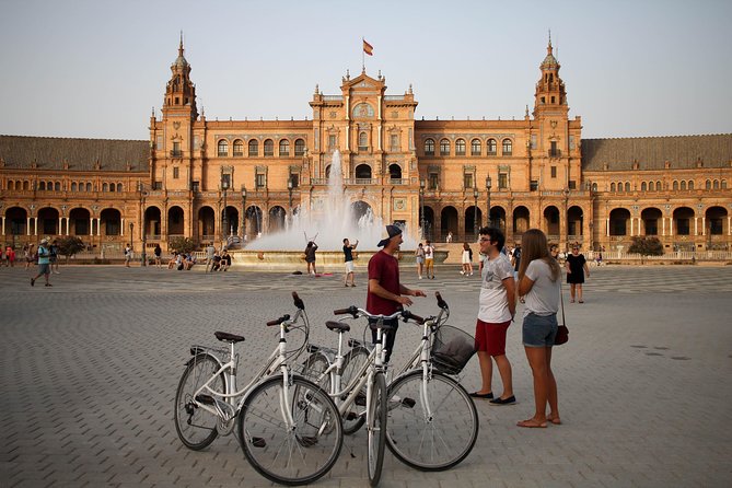 Sunset Guided Bike Tour in Seville - Palau de San Telmo, Real Fábrica de Tabacos, and Plaza de America