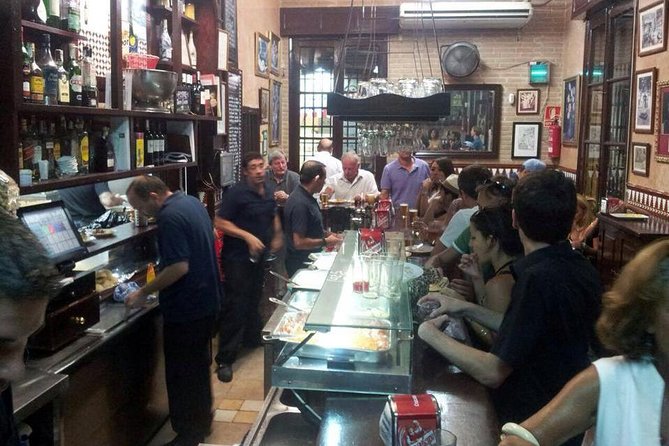 Tapas and Wine Tasting Tour in Seville Small Groups and Jewish Quarter - The Bar-Hopping Part: How Tapas Culture Works in Real Life