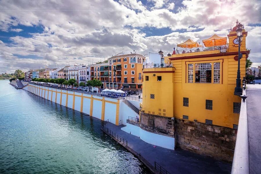 Triana La Flamenca Tour. Includes a visit to the Corrales - Torre del Oro and the River-Bridge Mindset
